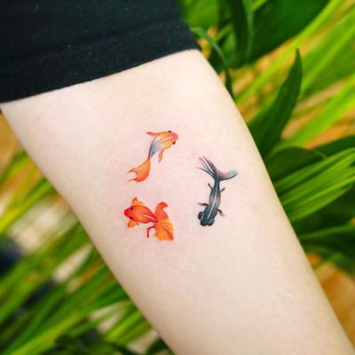 Watercolor tattoo by 9room #9room #watercolor #color #unique #nature #goldfish #fish #tinytattoo #smalltattoo