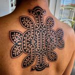 Pattern work tattoo by Swasthik Iyengar aka Gunga Ma #SwasthikIyengar #GungaMa #color #traditional #Hindu #sacredsymbols #sacrediconography #pattern #blackwork #shapes #backtattoo