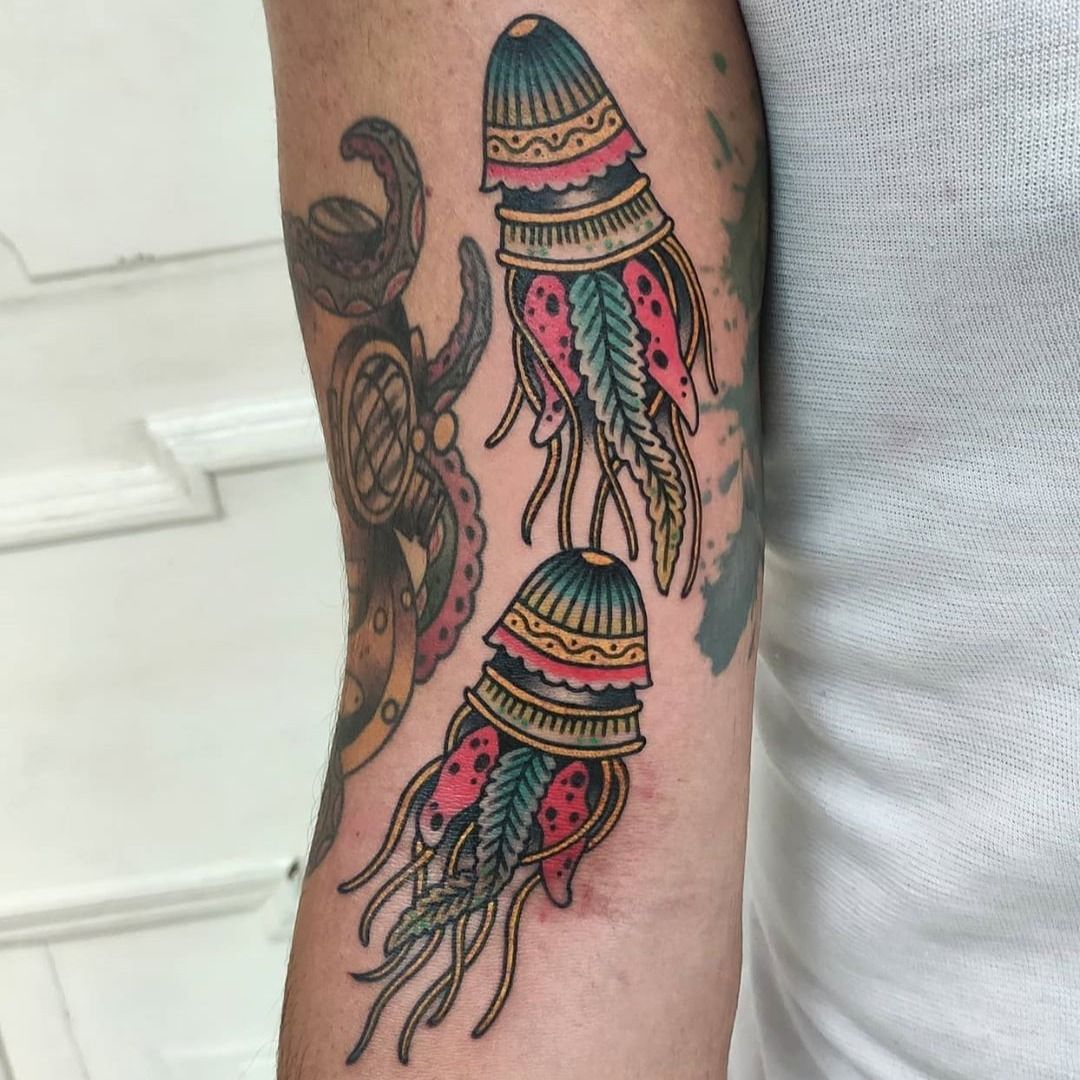 Pop art jellyfish tattoo on the left collarbone