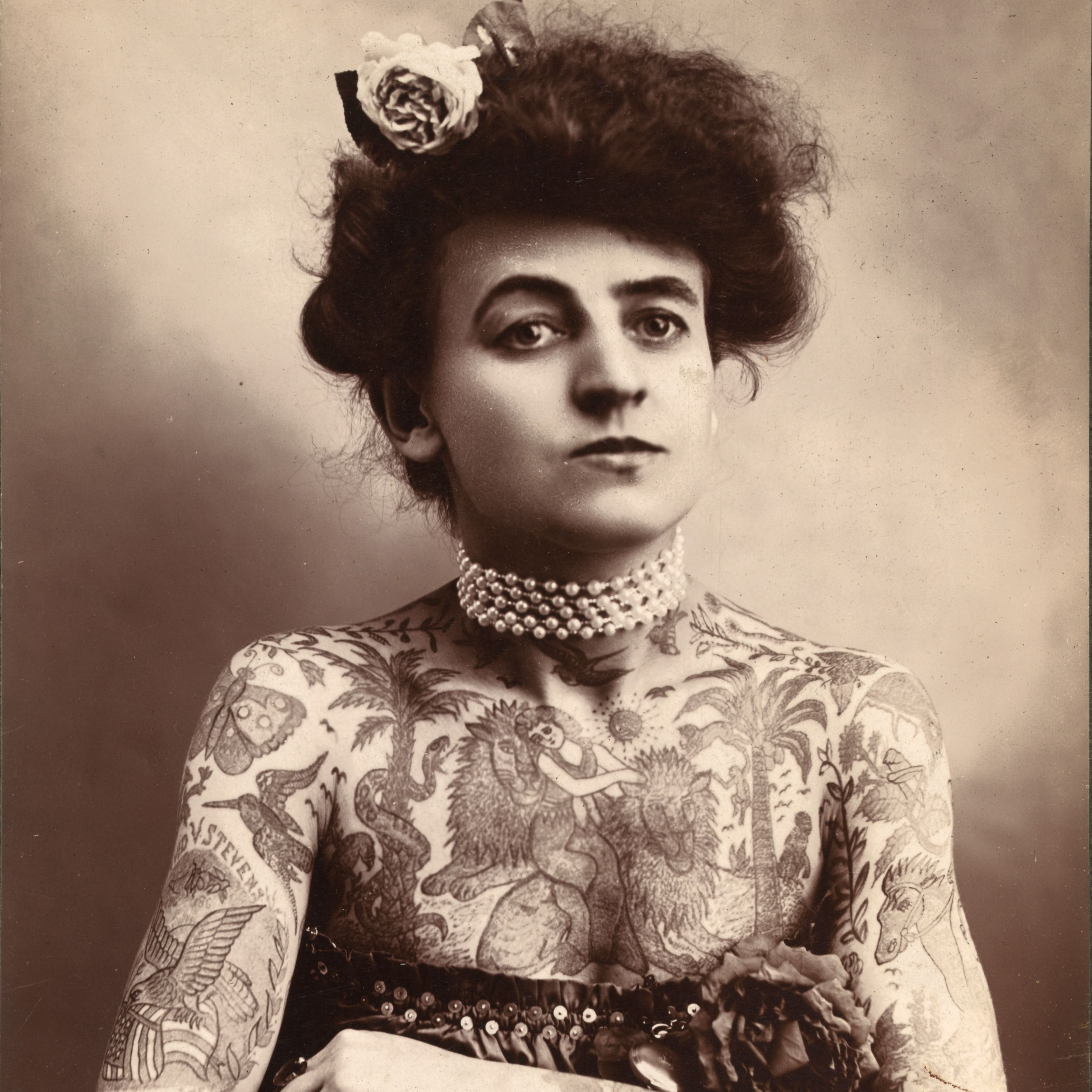 A Female Tattoo Artist Holding a Tattoo Machine  Free Stock Photo
