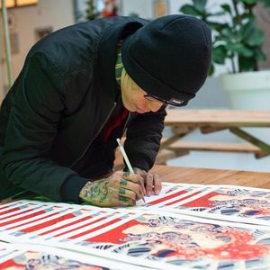 Shane Tan signing prints via Kintaro Publishing #ShaneTan #KintaroPublishing #artbooks #tattoobooks #tattooprints #tattooart