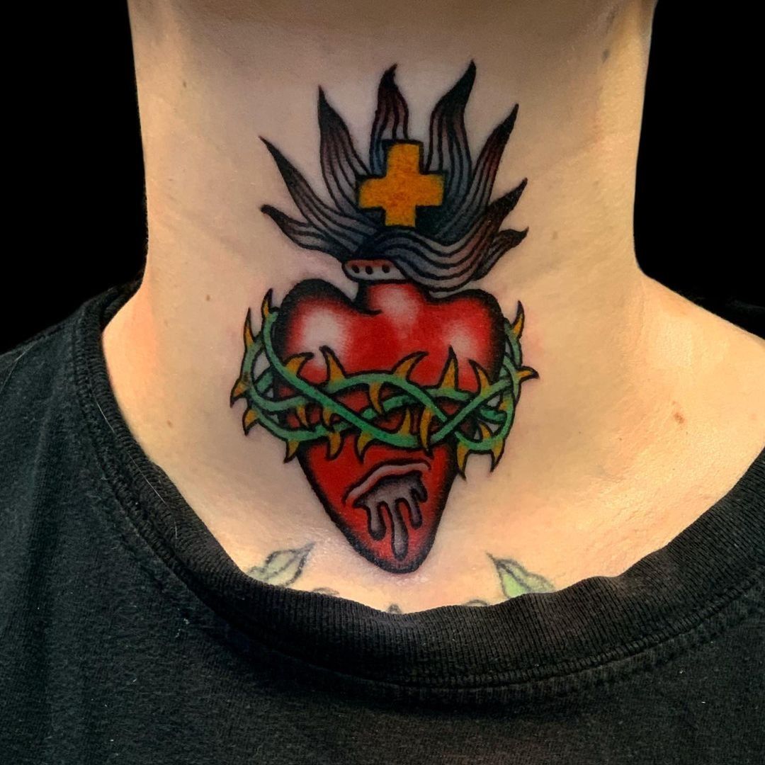 Tattoo uploaded by Tattoodo  Sacred heart neck tattoo by Alex Duquette  alexduquette sacredheart thorns cross fire neck  Tattoodo