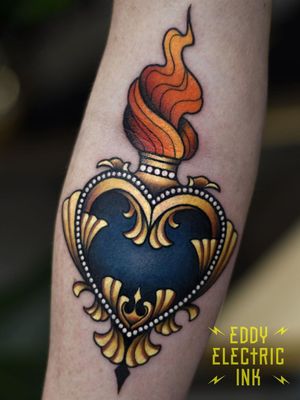 sacred heart tattoo by eddy electric ink #eddyelectricink #sacredheart #neotraditional #filigree #gold #fire
