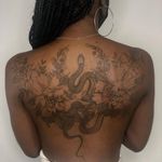 Snake tattoo by Anka Tattoo #ankatattoo #snake #flower #floral #animal #nature #tattoosondarkskin #darkskintattoo 