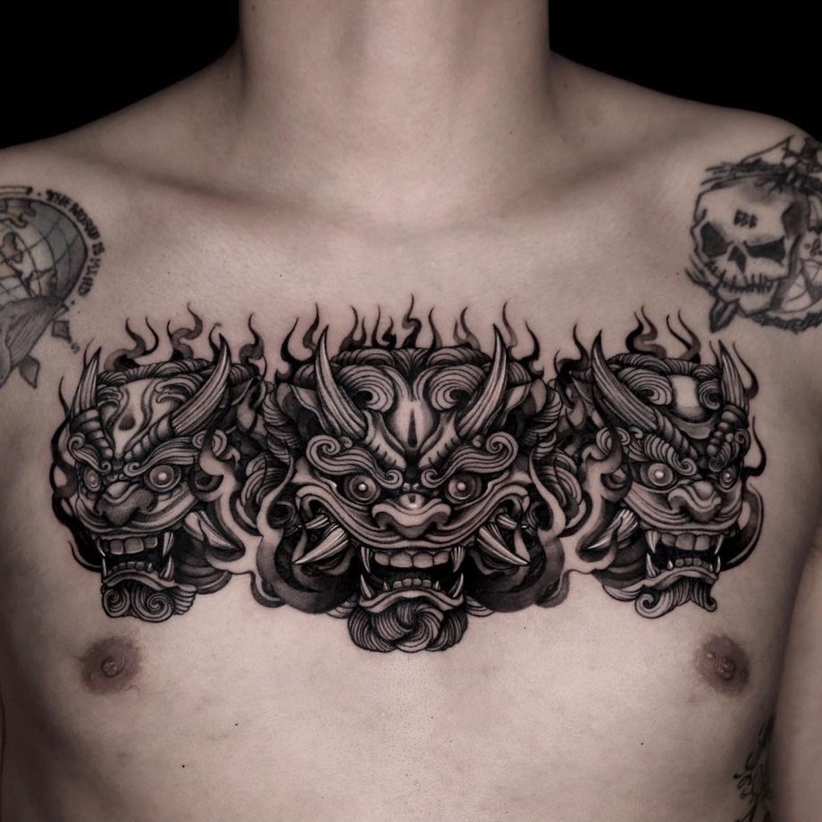 New School style foo dog tattoo located on the chest