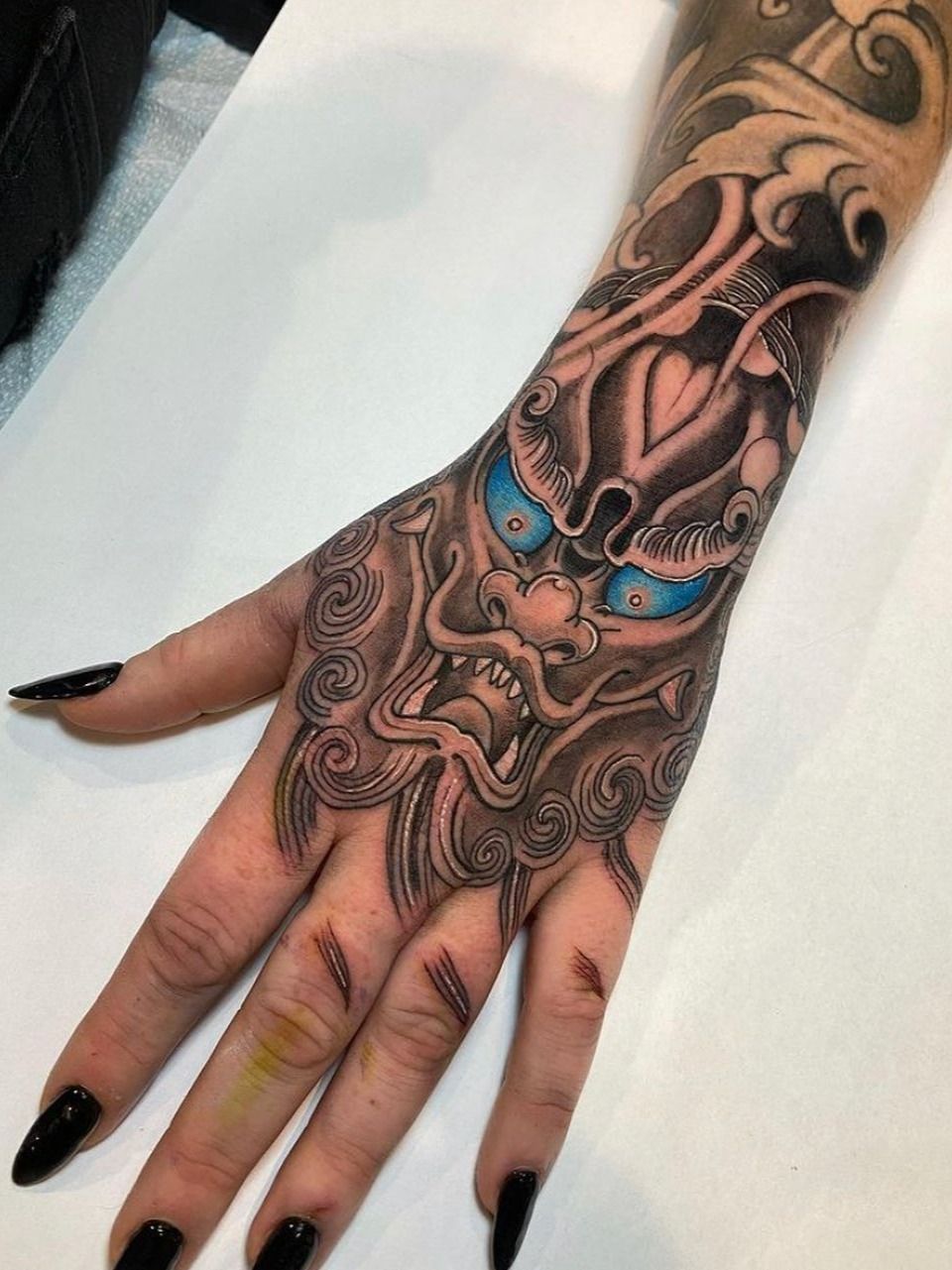 Dog Hand Tattoo by Nemesis Tattoo