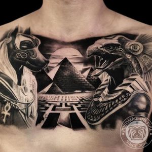 Egyptian chest tattoo by puedmag_inkpire #puedmaginkpire #chesttattoo #pyramid #ra #anubis #maze #blackandgrey #realism #Egyptiantattoos #egyptian #egypt #ancient #esoteric #history 