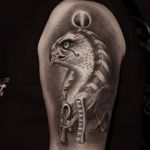 Upper arm Egyptian tattoo by jafarli tattoo baku #jafarlitattoobaku #horus #ankh #Egyptiantattoos #egyptian #egypt #ancient #esoteric #history #blackandgrey 