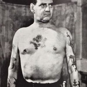 King Frederick IX bearing all to show off his nine tattoos versus his usual royal dress #tattooedroyalty #thetattooedking #historyoftattooing #navytattoos #militarytattoos