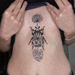 Illustrative tattoo by Nicolas Trotman aka Nick Trotman #NicolasTrotman #NickTrotman #illustrative #blackandgrey #nature #plant #beetle #leaves #leaf #sternum #flower #queertattooer #lgbtqia #bipoc #qttr #lgbt #qtbipoc