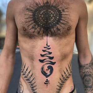 Unalome tattoo by maneentattoo #maneentattoo #unalome #blackwork #buddhism #buddhist #ribs #symbol #brushstroke #painterly