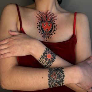 Tattoos by Sema Dayoub #semadayoub #nassimdayoub #traditionaltattoo #qttr #queertattooer #cuffs #bracelet #flower #sun #heart #sacredheart #threeofswords #chest #wrist