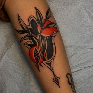 Tattoo by Sema Dayoub #semadayoub #nassimdayoub #traditionaltattoo #qttr #queertattooer #darkskintattoo #darkskinbodyart #hamsa #pomegranate #floral #plant #fruit #ornamental