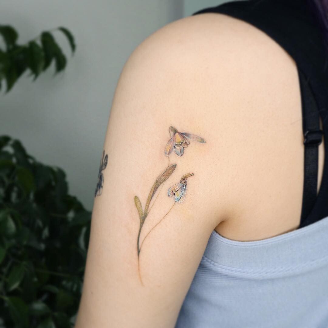 my first tattoo! it's a snowdrop flower :3 her @ is on instagram  (@inkedbyaj) location: Tuff City in bronx NY : r/tattoo
