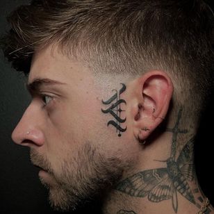 Face tattoo by El Dot Tattoo