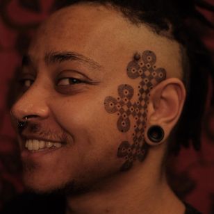 Face tattoo by Jayaism
