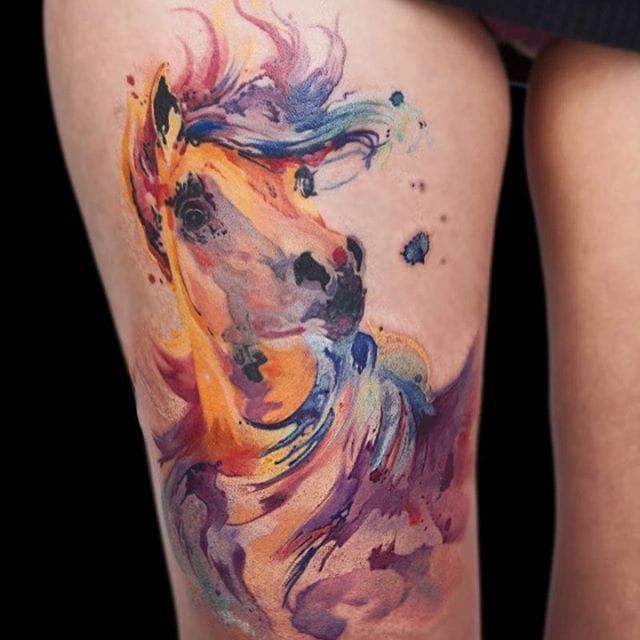 Horse tattoo located on the forearm done in watercolor