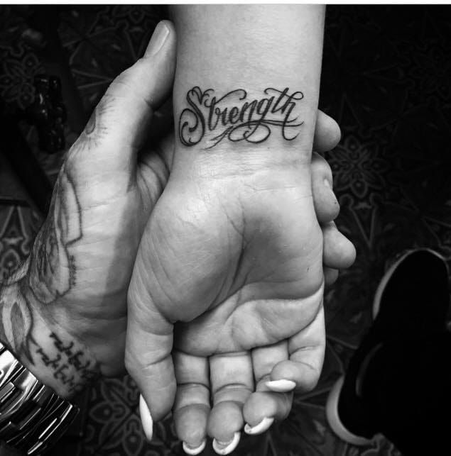 strength tattoo fancy lettering