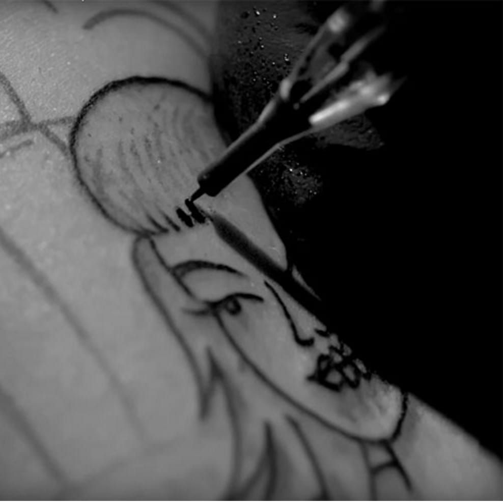 UltraSlow Motion Of Tattoo Gun On Transparent Skin  borninspace