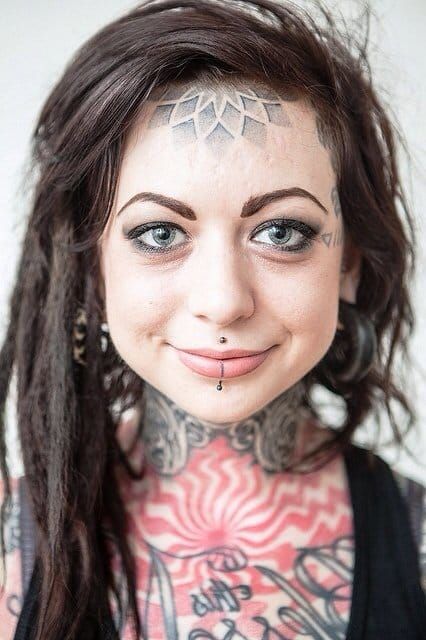 Bizarre forehead tattoos