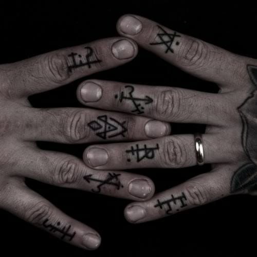 Bold lines arranged into bizarre symbols. Beautifully cryptic. Finger tattoo by Thomas Hooper, Rock of Ages Tattoo (Austin, Texas)
