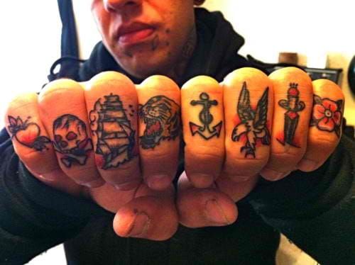 Solid traditional finger tattoos. Skull finger tattoo looks so cool! Artist unknown. #finger #fingertattoo #skull #ship #heart #flower #knife