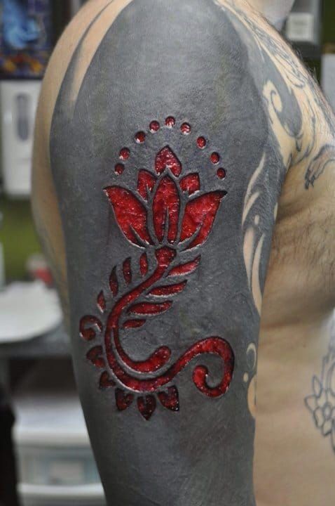 Sleeve tattoo scarification