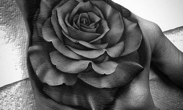 black rose tattoo hand