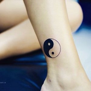 Clean yin yang tattoo, Artist unknown.