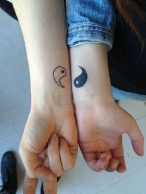 Matching yin yang tattoos