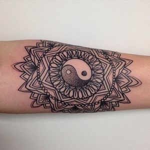 Beautiful linework tattoo of mandala and yin yang