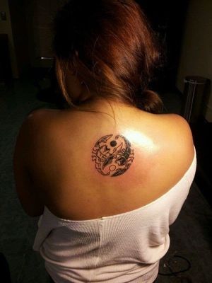 Animal-inspired yin yang tattoo