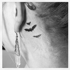 Tiny Bat Tattoos Behind Ear in 2023  Neck tattoo Bats tattoo design Bat  tattoo