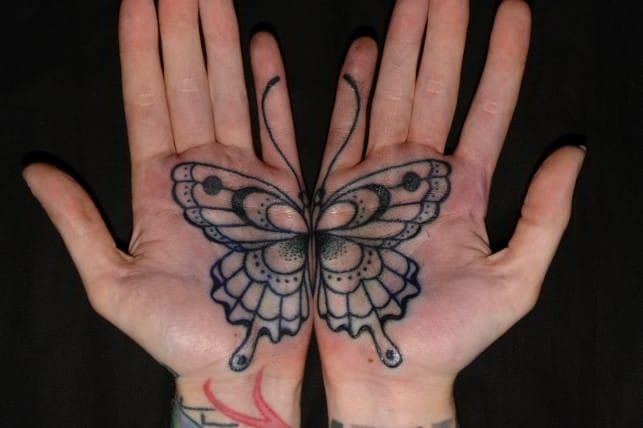 Tiny butterfly couple tattoo located on the hand