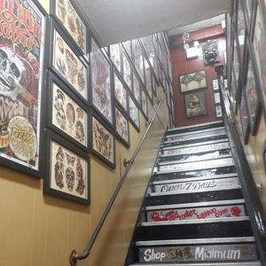 A photograph of the first flight of stairs up to Red Rocket Tattoo (IG-redrockettattoo). #NYC #RedRocketTattoo #RogueOne #StarWars #StarWarsDay