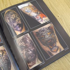 A page full of tigers and leopards from Meows and Roars of Inspiration. #artbook #cats #felines #fineart #MeowsandRoarsofInspiration #tattoobook