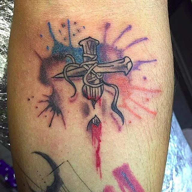 cross under skin tattoo