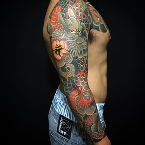 A sleeve with a dragon holding a magical orb by Caio Pineiro (IG—caiopineiro). #CaioPineiro #dragon #Irezumi #Japanese #traditional