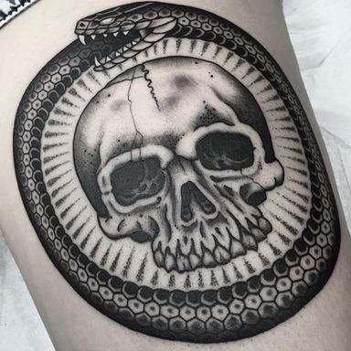 The Cyclical Nature of the Universe Represented by Ouroboros Tattoos