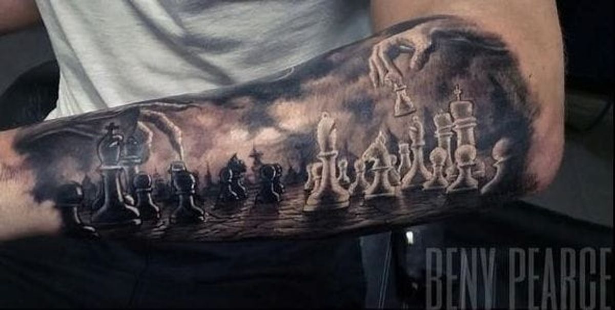 Matching king and queen chess pieces tattooed for