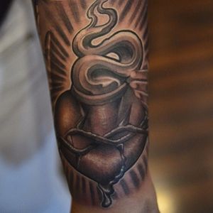 Nice black and grey new school tattoo by Abey Alvares.