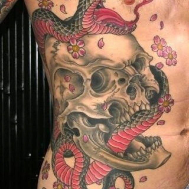 Skull and snake side tattoo... artist unknown