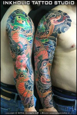 Awesome snake sleeve by Inkholic Tattoo Studio