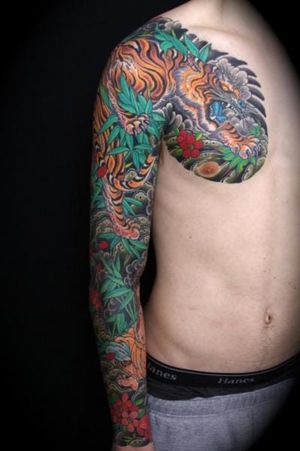 Tiger chest and sleeve tattoo by Kings Avenue