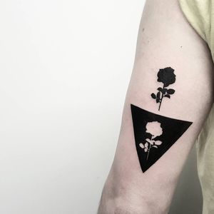 Released rose tattoo by Matteo Nangeroni #MatteoNangeroni #flowertattoos #blackwork #silhouette #rose #flower #negativespace #abstract #minimal #triangle #flower #nature #tattoooftheday