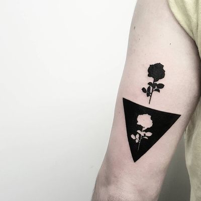 Released rose tattoo by Matteo Nangeroni #MatteoNangeroni #flowertattoos #blackwork #silhouette #rose #flower #negativespace #abstract #minimal #triangle #flower #nature #tattoooftheday