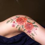 Roses tattoo by Tattooist Silo #TattooistSilo #Silo #flowertattoos #flowers #roses #daisies #leaves #nature #floral #plant #color #watercolor #realistic #illustrative #tattoooftheday