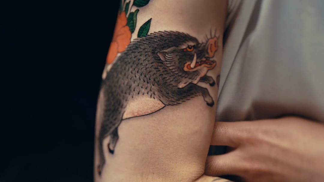 Boar tattoo by Chris Garver #ChrisGarver #TaikiMasuda #residentartists #thetattooshop #miami #wynwood #tvseries #facebookwatch #boar #color #Japanese #wildboar #pig #flower