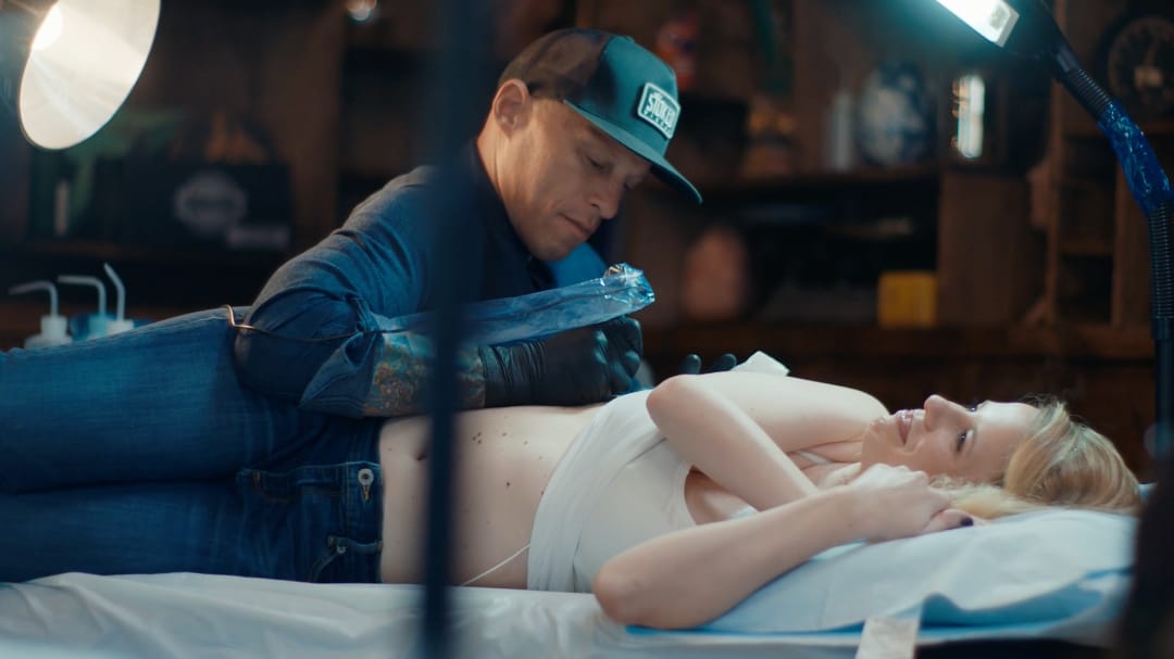 Ami tattooing Mary Ann #AmiJames #residentartists #thetattooshop #miami #wynwood #tvseries #facebookwatch #linework #heart #script