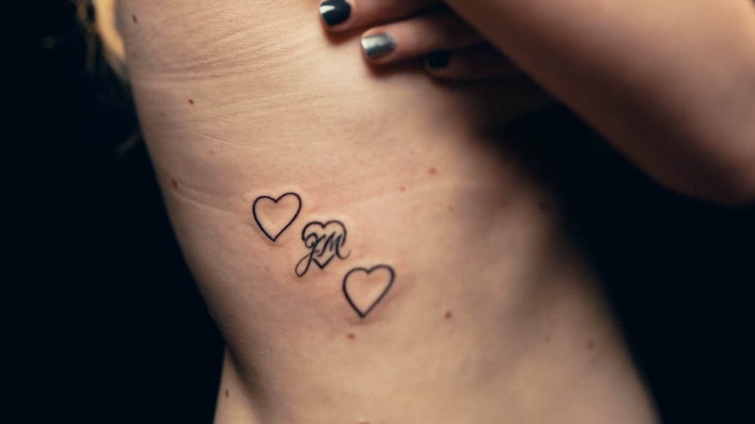 Mary Ann's heart tattoo by Ami James #AmiJames #residentartists #thetattooshop #miami #wynwood #tvseries #facebookwatch #linework #simple #script #heart #initials #love